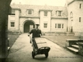 College porter with luggage c.1935